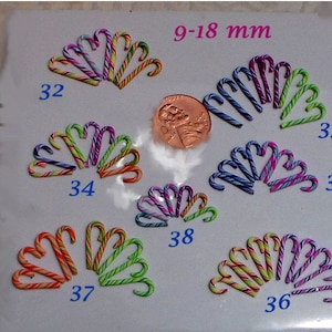 May include: Assortment of 10 miniature candy canes in various colors and patterns, measuring 9-18 mm. The candy canes are arranged in groups of 2-3, labeled with numbers 32, 33, 34, 35, 36, 37, 38.