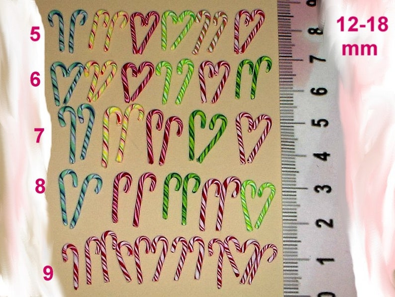 May include: A sheet of 20 candy cane stickers in various colors, including red, green, and white. The stickers are approximately 12-18 mm in size.