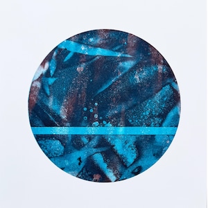 May include: Abstract artwork featuring a circular design with a textured, layered appearance. The color palette includes shades of blue, teal, and brown, with a horizontal teal line bisecting the circle. The artwork is set against a white background.
