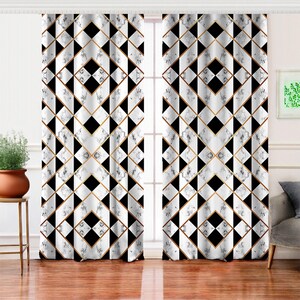 May include: Geometric patterned window curtains. The curtains feature a repeating design of black, white, and gold diamond shapes. The fabric has a marble-like texture, adding depth to the design. The curtains are hanging in front of a window.