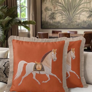 Experience the touch of high-end textile design with our Fringed Horse Pillow. The warm burnt orange hue is on-trend for seasonal decor, while the classical horse imagery adds timeless sophistication. The hidden zipper ensures a seamless look, and the delicate fringe work showcases true craftsmanship. Perfect for luxury apartments or rustic cottages, this cushion cover bridges the gap between modern style and traditional equestrian art.
