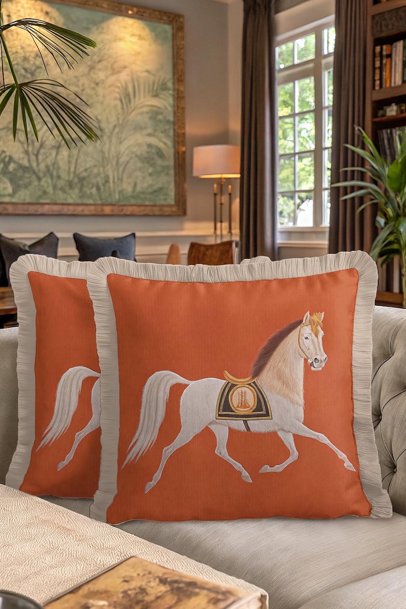 Combine the free-spirited vibe of bohemian decor with the elegance of luxury textiles. Our Fringed Horse Cover features a unique mix of tassels and classical imagery. The vibrant orange hue provides a bold contrast to the cream-colored fringes, making it a standout piece for boho-chic interiors. Elevate your space with this unique blend of patterns and textures.