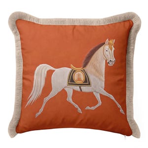 Infuse your space with warmth and energy using our Burnt Orange Decorative Pillow. The bold background color is beautifully offset by a graceful white horse motif and soft cream tassels. Orange is known for creating a welcoming atmosphere, making this fringed cover ideal for guest rooms or entryways. Add a pop of sophisticated color and a touch of classical artistry to your interior design today.