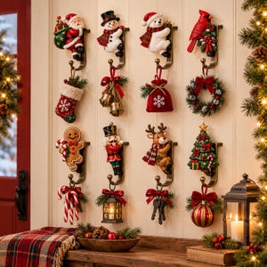 May include: A set of twelve decorative wall hooks featuring Christmas-themed figures including Santa, a snowman, a polar bear, a cardinal, a gingerbread man, a nutcracker, a reindeer, and a tree, each holding a holiday ornament or item.
