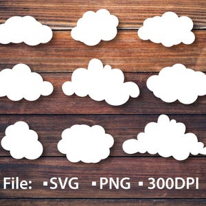 May include: Nine white cloud cutouts of varying sizes are arranged on a dark brown wooden surface. The clouds have a puffy, cartoon-like appearance. The bottom of the image displays the text "File: SVG • PNG • 300DPI".