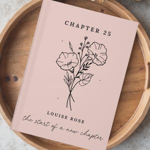 May include: A light pink book with a black line art illustration of flowers in the center. The text reads CHAPTER 25 at the top, and LOUISE ROSE the start of a new chapter at the bottom in black lettering. The book has a clean, simple cover design.