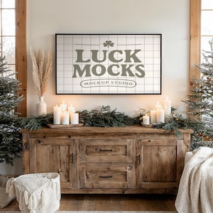 May include: A rustic wooden cabinet with a framed print that reads "LUCK MOCKS Mockup Studio." The cabinet is decorated with candles, greenery, and a woven basket. The scene evokes a cozy, inviting atmosphere, perfect for home decor.