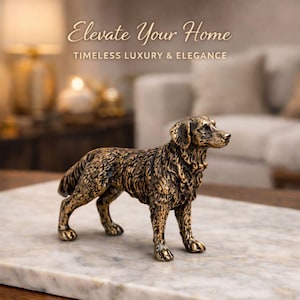 Może przedstawiać: Brązowa figurka psa, stojąca na marmurowej powierzchni. Pies ma szczegółowe, teksturowane futro i stoi. Tekst "Elevate Your Home" i "Timeless Luxury & Elegance" znajduje się w tle.