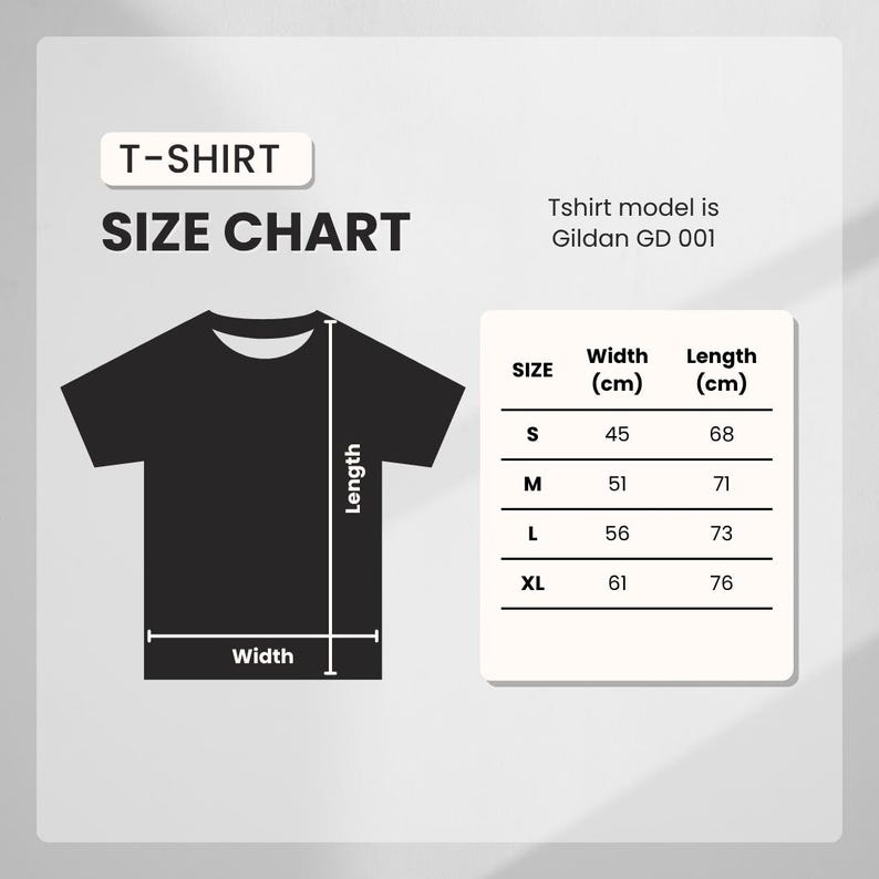 May include: A black t-shirt size chart with measurements in centimeters. The chart includes sizes S, M, L, and XL, with corresponding width and length measurements. The t-shirt model is Gildan GD 001.
