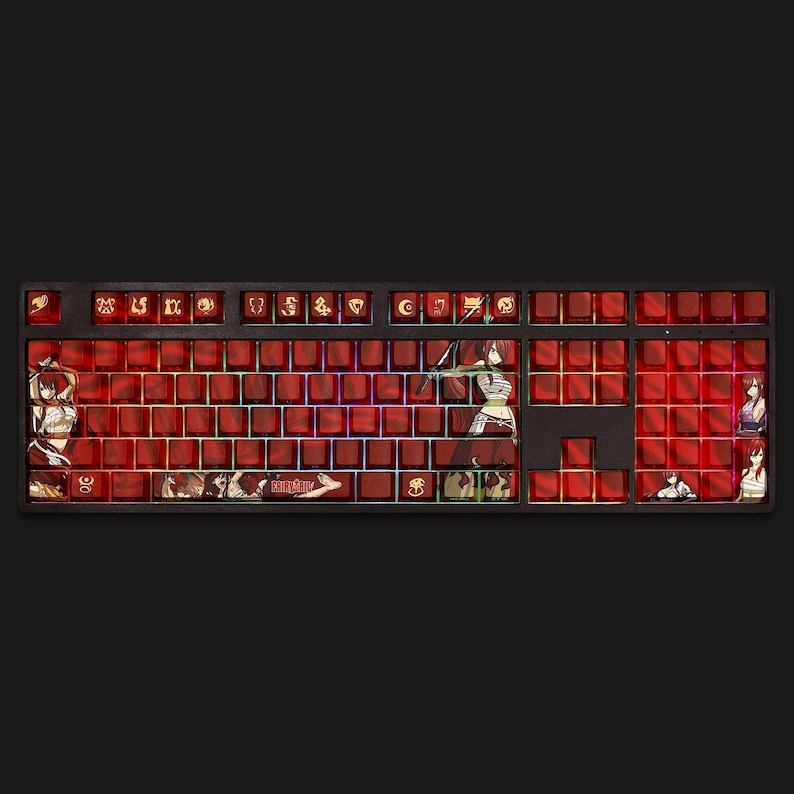 May include: A custom mechanical keyboard with red keycaps and a black frame. The keycaps feature anime character illustrations and the "Fairy Tail" logo. The keyboard has a full layout with a variety of function keys and a number pad.