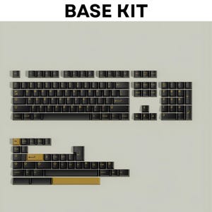 May include: A black and gold mechanical keyboard base kit. The keycaps are black with gold legends. The kit includes various keycap sizes and layouts, with the text "BASE KIT" at the top.