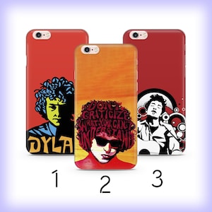 May include: Three phone cases with pop art designs. One case is red with a black and yellow portrait and the name "DYLA". Another case is orange with a portrait and the text "DON'T CRITICIZE WHAT YOU CAN'T UNDERSTAND". The third case is red with a black and white portrait.