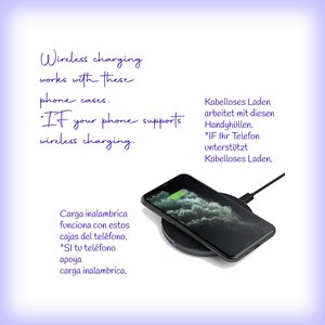 May include: A black smartphone resting on a circular wireless charging pad. The screen displays a green battery icon. Text in English states: Wireless charging works with these phone cases. IF your phone supports wireless charging.