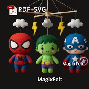 May include: A handcrafted baby mobile with three superhero figures: Spider-Man, Hulk, and Captain America. The mobile includes felt clouds and lightning bolts, with the text "MagixFelt" at the bottom. It is suspended from a wooden frame.