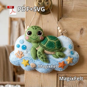 May include: A felt sea turtle wall hanging. The green turtle has a patterned shell and is on a blue cloud with felt starfish, bubbles, and coral. The text "PDF+SVG" is in the upper left corner, and "MagixFelt" is in the lower right corner.