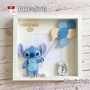 May include: A framed shadow box featuring a blue felt Stitch character holding balloon strings. The box includes a small white alarm clock, felt balloons, and the name "MATTHEW" in wooden letters. The text "PDF+SVG" is in the upper left corner.
