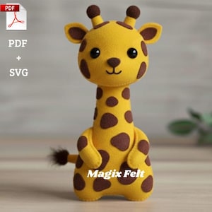 May include: A handmade yellow felt giraffe with brown spots, ears, and a tail. The giraffe has a smiling face and the text "Magix Felt" is printed on the front. The image also includes the text "PDF + SVG".