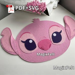 May include: A pink felt craft featuring a character's face with large ears, eyes, and nose. The character's eyes are dark blue with a white highlight. The text "PDF+SVG" and "MagixFelt" are visible.