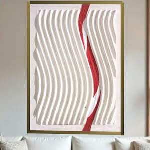 May include: Abstract wall art featuring a textured white surface with vertical wave-like patterns and a vibrant red stripe. The artwork is framed in a gold-colored border, creating a modern and artistic aesthetic.
