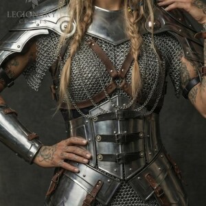 May include: A silver metal armor set with chainmail and leather straps. The armor includes shoulder plates, a chest piece, and arm guards. The text "LEGION SKY CRAFTS" is visible on the shoulder plate.