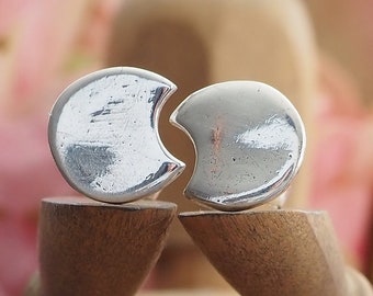 A stunning pair of tiny fine silver moon stud earrings on sterling silver posts...