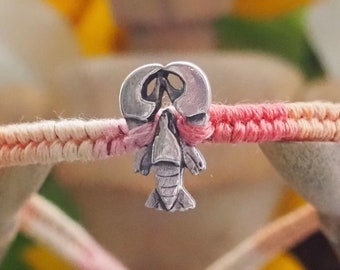 A beautiful tiny lobster handmade in fine silver on a peachy pinks leather, sterling silver and cotton friendship bracelet…