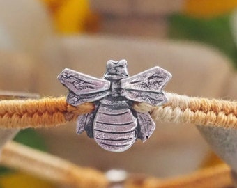 A beautiful llittle bumble bee handmade in fine silver on a soft yellow leather, sterling silver and cotton friendship bracelet...