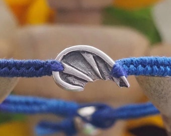 A lovely unique fine silver devil wing on a gorgeous deep blue leather, cotton and sterling silver friendship bracelet.