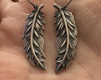 A wonderful pair of handmade fine silver curved feathers on sterling silver wires