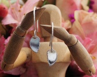 A pair of simple broken heart earrings handmade in fine silver on handmade sterling silver wires.