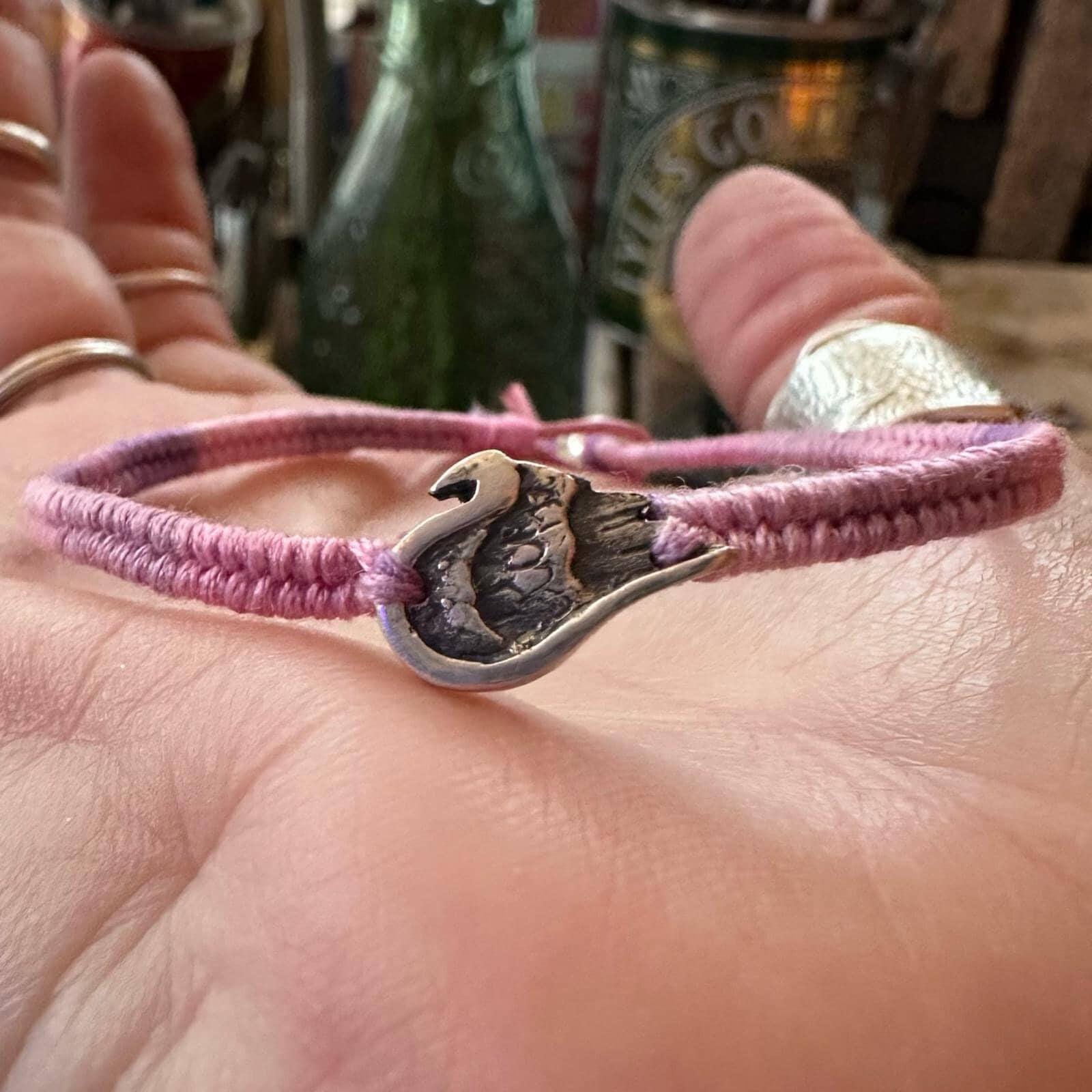 A gorgeous little fine silver angel wing on a beautiful pinky purple  leather, cotton and sterling silver friendship