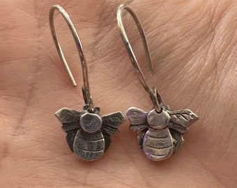 A stunning little pair of handmade fine silver bee earrings on hand formed sterling silver wires...