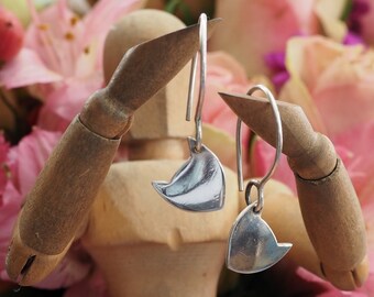 Delightful simple fine silver cat face earrings on handmade sterling silver wires.