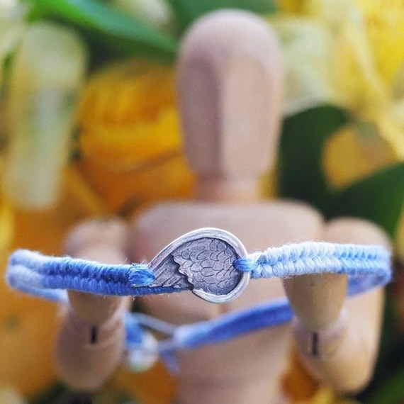 A gorgeous deep blue leather, cotton and sterling silver friendship  bracelet with a lovely handmade fine silver angel