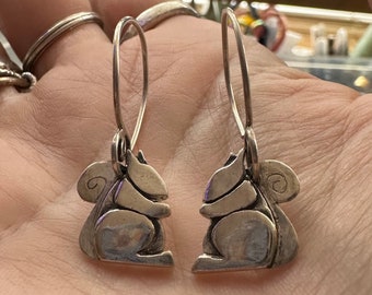 A pair of adorable little fine silver squirrel earrings on handmade sterling silver wires.