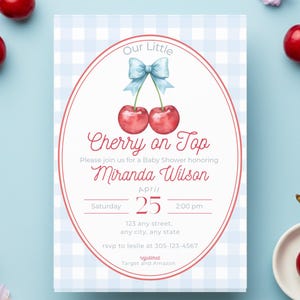 May include: Baby shower invitation with a watercolor cherry design. The invitation features the text "Our Little Cherry on Top" and details for the event, including the date, time, and location. Fresh cherries and flowers are scattered around the invitation on a light blue background.