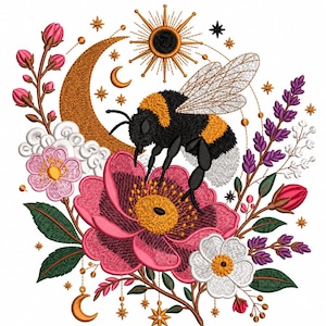 May include: An embroidered design featuring a bumblebee hovering over a pink flower. The design includes a crescent moon, sun, stars, and various floral elements in shades of pink, gold, purple, and green, all set against a white background.
