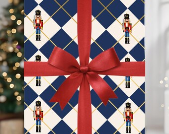 May include: A wrapped present with a red satin bow. The wrapping paper features a pattern of navy blue diamonds, gold lines, and toy soldier illustrations. A Christmas tree is in the background.