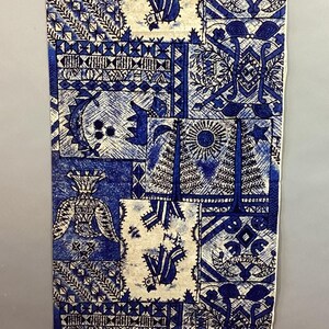 May include: A rectangular piece of fabric with a repeating pattern of blue and white geometric and stylized floral designs. The fabric features a variety of shapes, including squares, triangles, and sunbursts. The overall aesthetic is reminiscent of traditional textile art.