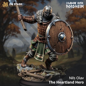 May include: A detailed figurine of a Viking warrior, Nils Olav, the Heartland Hero, wielding an axe and shield. The figure is clad in armor, a helmet, and fur accents. The shield is wooden with metal trim. The text "Shadow Over Nordheim" is visible.