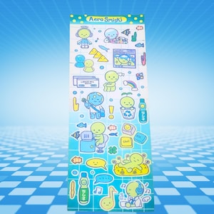 May include: Aero Smiski sticker sheet featuring various cartoon characters in shades of blue, green, and yellow. The sheet includes images of fish, rainbows, musical notes, and computer-related icons. The text "Leave me alone" is visible on the sheet.