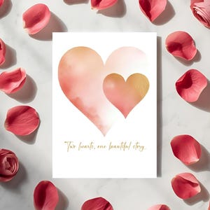 May include: A greeting card with two watercolor hearts in shades of peach and gold, surrounded by pink rose petals. The card features the text "Two hearts, one beautiful story" in gold script, perfect for a wedding or anniversary.
