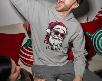 May include: A gray hoodie featuring a Santa Claus graphic with sunglasses and the text "Every Day I'm Ho Ho Ho'n". The person is wearing reindeer antlers glasses and holding a red and white can.