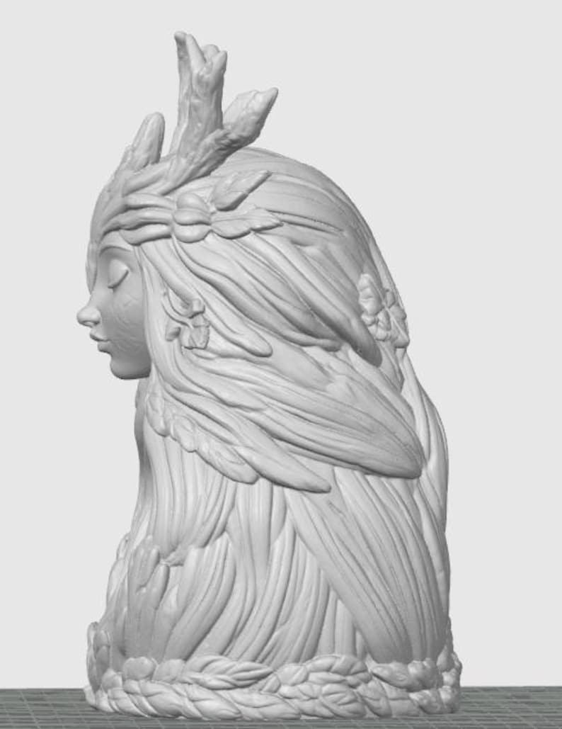 May include: A light gray 3D rendered bust of a figure in profile, featuring long flowing hair adorned with sculpted leaves and branches. The figure has closed eyes and a serene expression, with a base decorated with a ring of carved foliage.