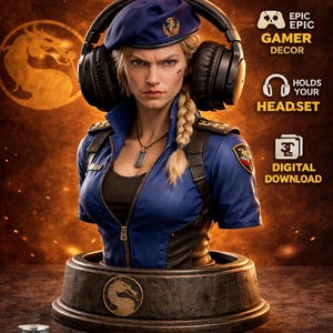 May include: A Sonya Blade headphone stand, depicting the character in a blue uniform and beret, holding headphones. The stand is Mortal Kombat themed, with text reading "Epic Gamer Decor" and "Holds Your Headset". The image also includes the text "Digital Download".