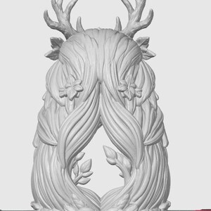 May include: A light gray 3D rendered sculpture featuring a central figure with long, flowing hair adorned with small flowers. The figure has prominent deer antlers extending from the top, and the base is surrounded by a dense layer of sculpted leaves.