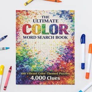 May include: A colourful word search book titled "The Ultimate Color Word Search Book" with the text "100 Vibrant Color-Themed Puzzles" and "4,000 Clues." Crayons and markers in various colours surround the book.