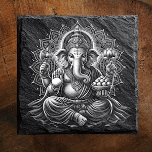 May include: Black and white illustration of the Hindu deity Ganesha, seated in a meditative pose. Ganesha, with an elephant head, is holding a lotus flower and a bowl of sweets. The image is set against a detailed mandala background on a square, textured surface.