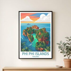 May include: A framed art print showcasing an illustration of the Phi Phi Islands in Thailand. The image presents green islands in turquoise waters, set against a sunset sky. The text "PHI PHI ISLANDS THAILAND" is at the bottom of the print.