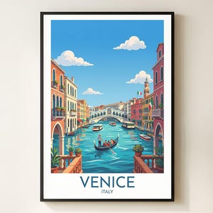 May include: A framed art print of Venice, Italy, featuring a canal scene with gondolas, bridges, and colorful buildings. The artwork has a bright blue sky with fluffy white clouds. The word "VENICE" is at the bottom.